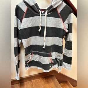 Women’s size medium Billabong hoodie - thin material. Cute underneath jacket